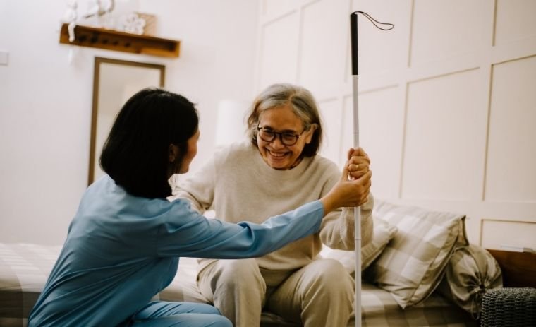 A caregiver providing compassionate in-home assistance to a senior woman as part of Ohio home care services.