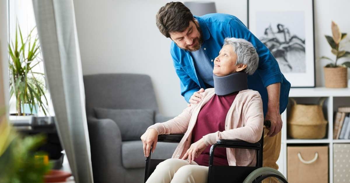 Paid Family Caregiver in Ohio assisting an elderly woman in a wheelchair at home with care and support.