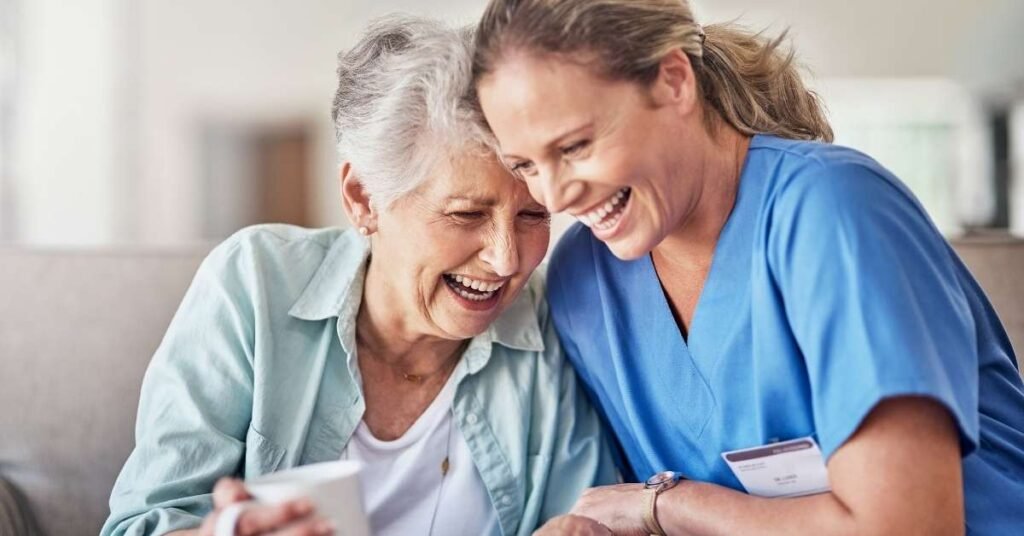 Paid family caregiver supporting an elderly woman at home, showing key considerations for paid family caregivers in Ohio home care programs.